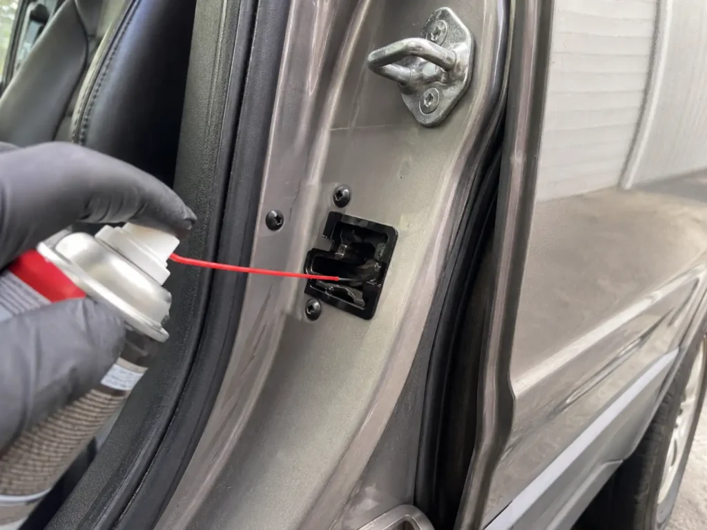 Cleaning Ford Escape door latch switch to fix door ajar light