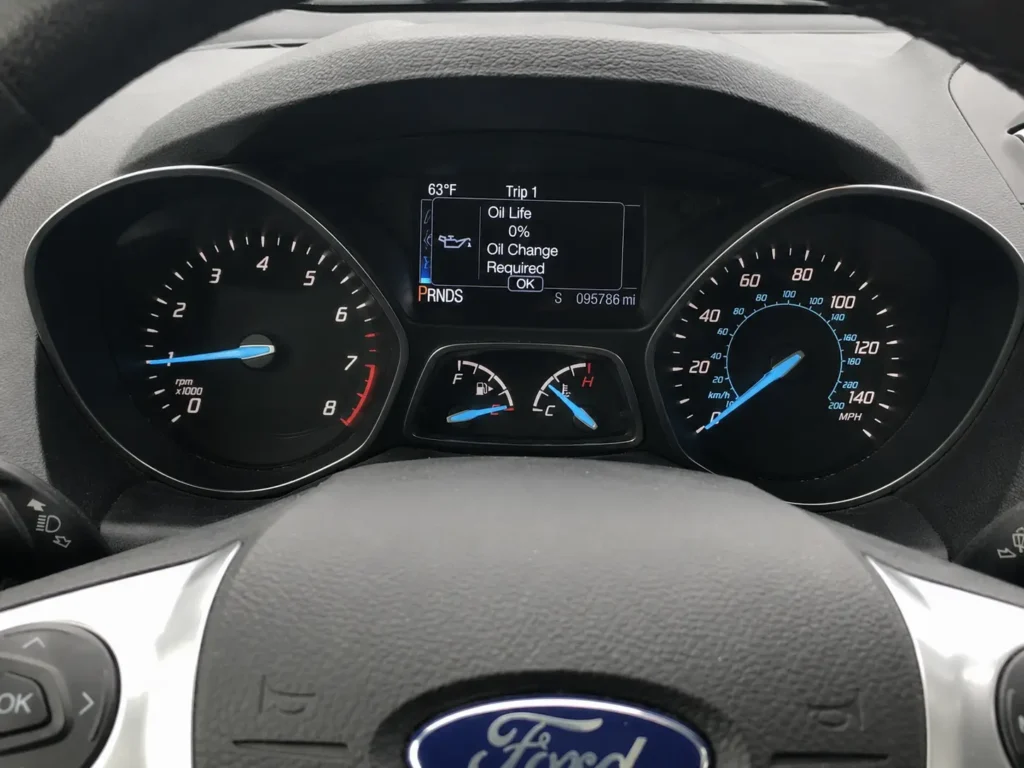 2016 Ford Escape Oil Reset — 3 Methods + Engine Oil Specs for All Engines 2 2016 Ford Escape dashboard showing oil life at 0 percent with Oil Change Required message on the instrument cluster.