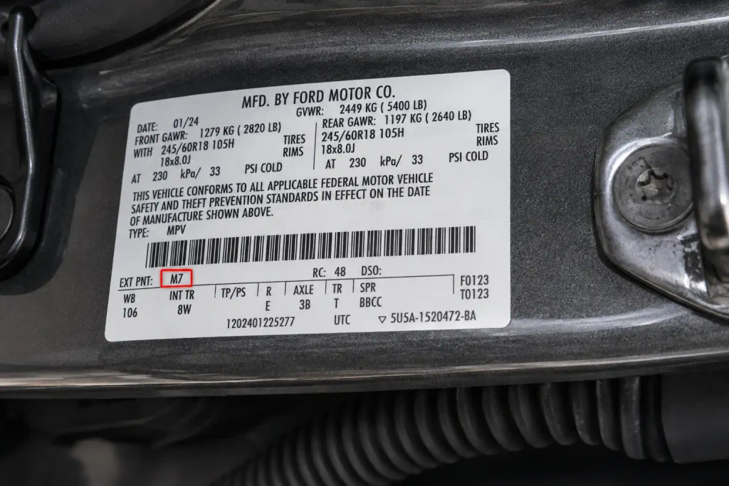 Ford Carbonized Gray Paint Code: M7 by Model and Year 2026 3 Ford door jamb label showing Carbonized Gray M7 paint code location