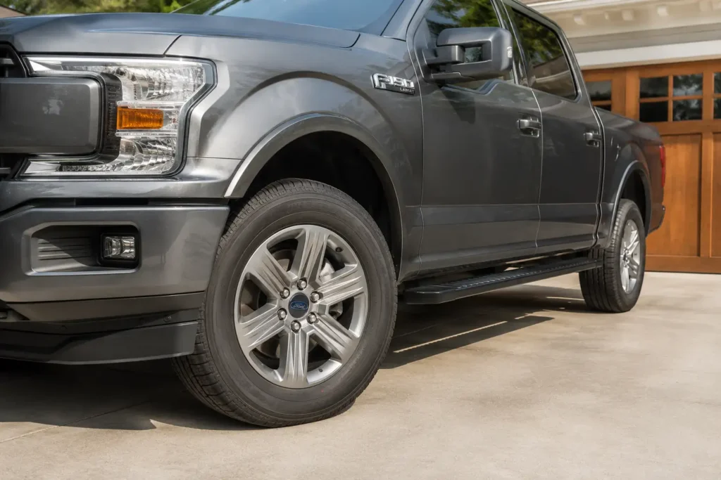 Ford F-150 factory wheel showing OEM 18 inch alloy rim