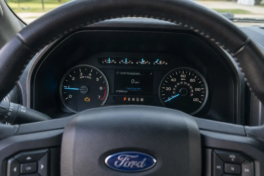 Ford F-150 dashboard showing check engine light for P0420 code