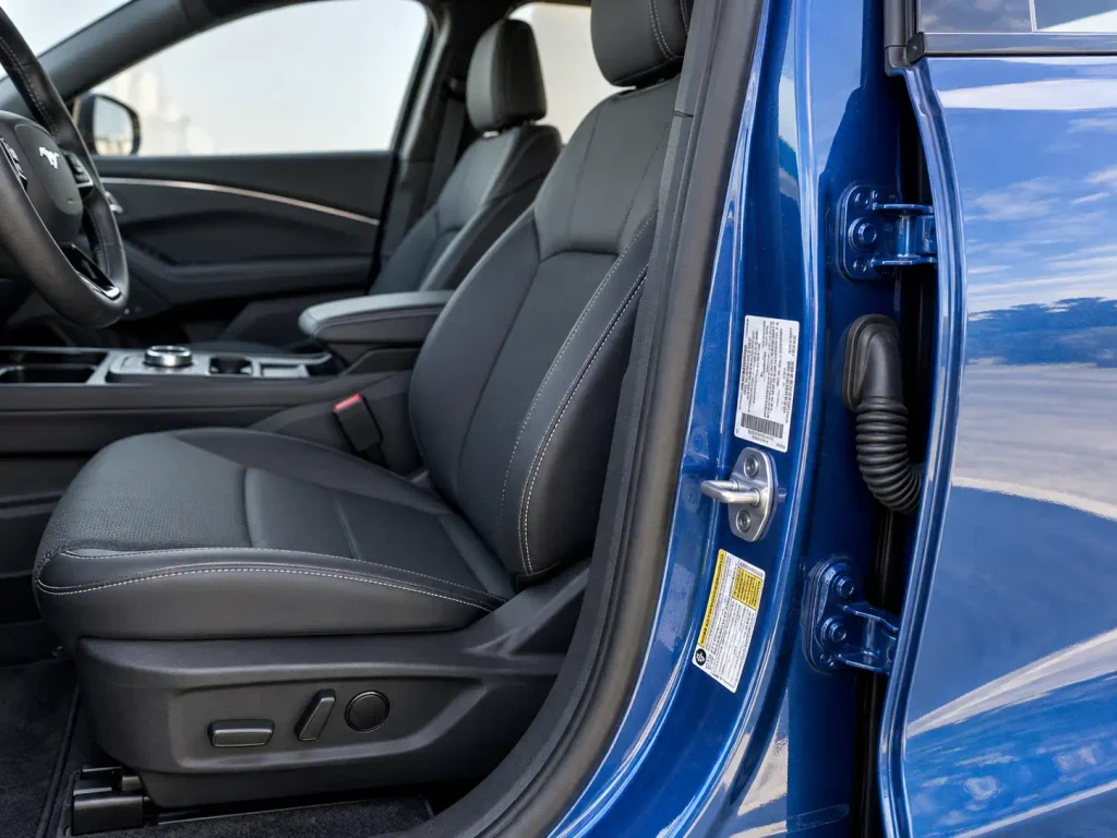 Ford Mustang Mach-E driver-side door jamb showing factory paint code label location